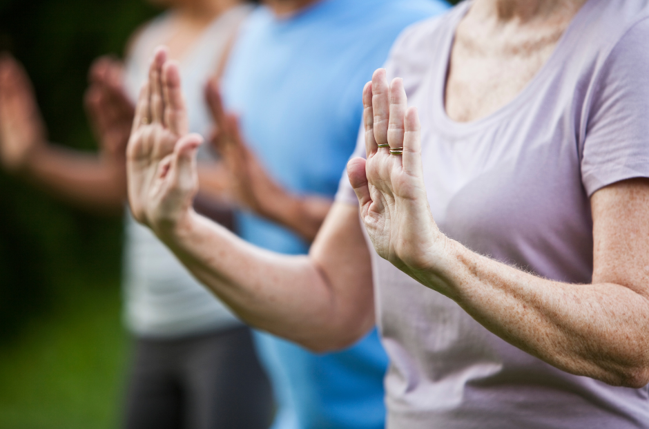 Close up of movement - T'ai Chi class, over 50's exercise class Hertford
